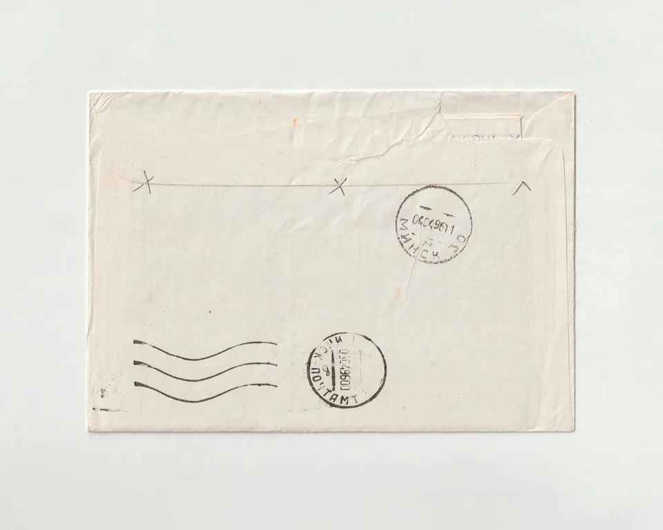 Vintage envelope with postage stamps and dated postmarks illustrating mail delivery.